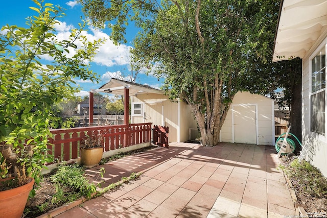 view of patio featuring a shed