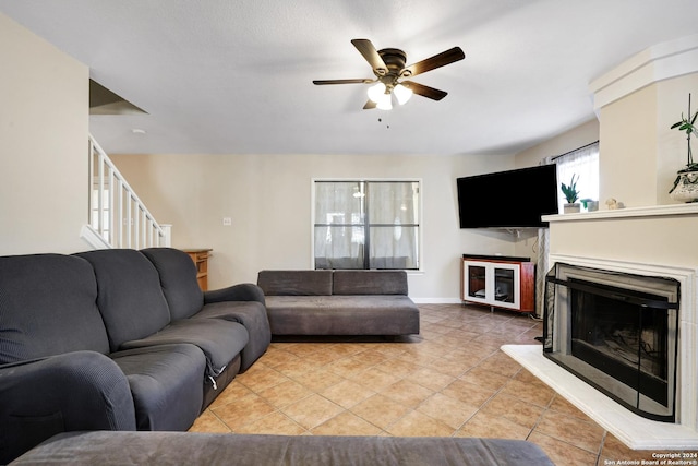 tiled living room featuring ceiling fan