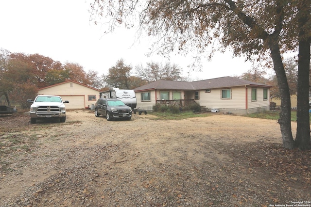 view of front of home with an outbuilding and a garage