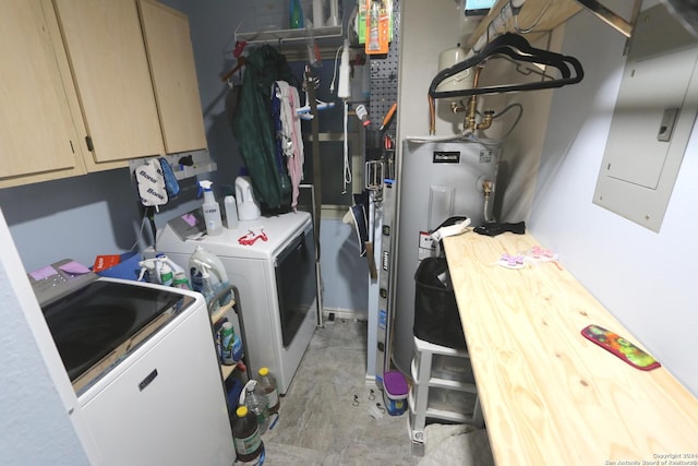 clothes washing area featuring washing machine and dryer, electric panel, and cabinets