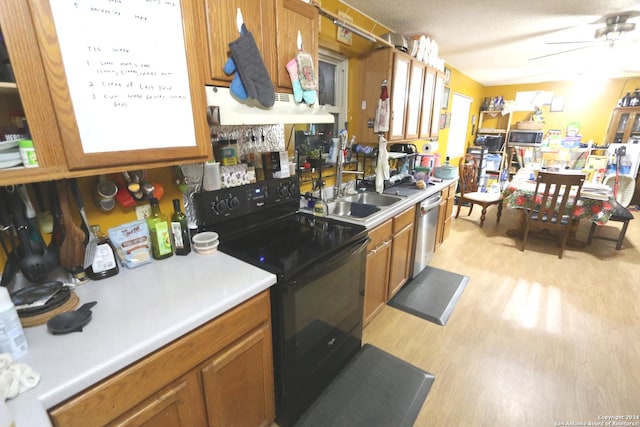 kitchen with ceiling fan, dishwasher, sink, range hood, and black / electric stove