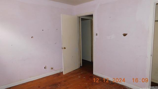 spare room with hardwood / wood-style flooring