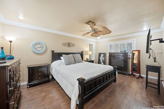 bedroom featuring ceiling fan, dark wood-type flooring, and ornamental molding