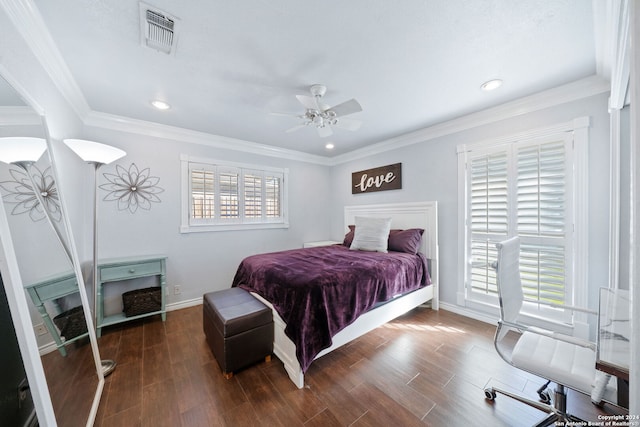 bedroom featuring ceiling fan, crown molding, and dark wood-type flooring