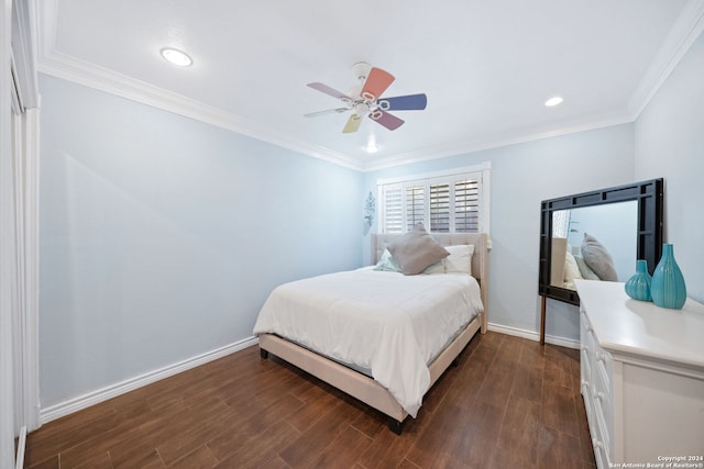 bedroom featuring dark hardwood / wood-style floors, ceiling fan, and crown molding