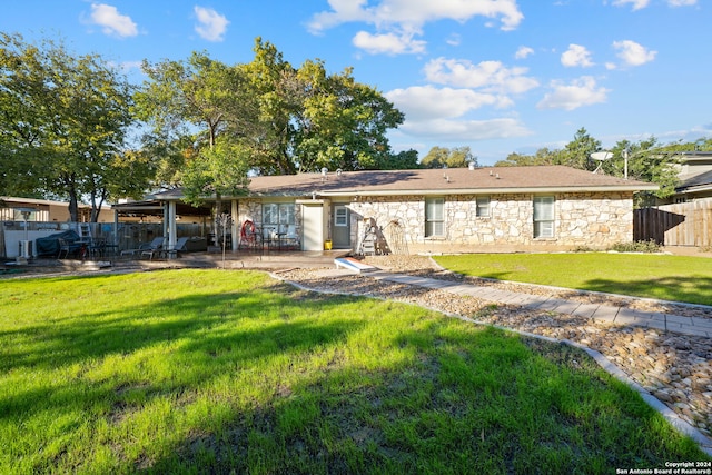 view of front of house with a patio and a front yard