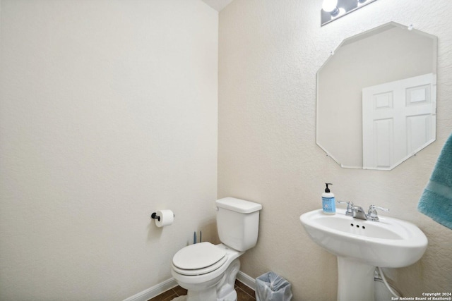 bathroom with toilet and sink