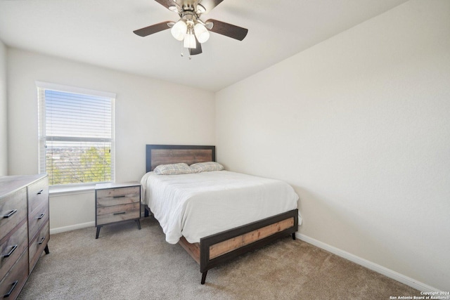 bedroom featuring ceiling fan and light carpet