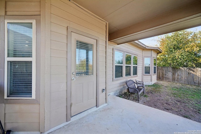 entrance to property featuring a patio area