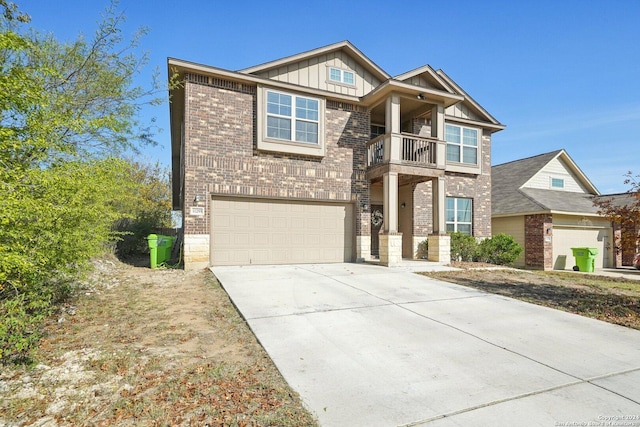 view of front of property with a balcony and a garage