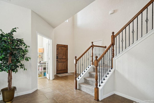 entrance foyer with high vaulted ceiling