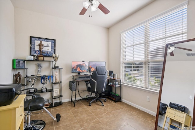 office space featuring ceiling fan and light tile patterned flooring