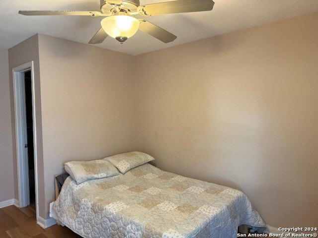 bedroom featuring ceiling fan and hardwood / wood-style floors