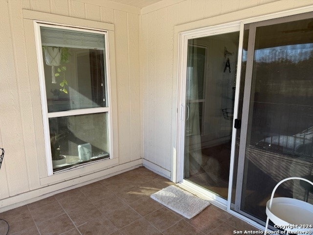 entrance to property with a patio