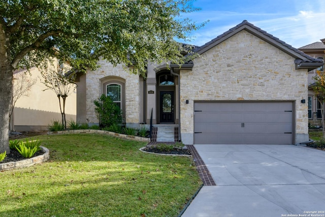 view of front facade with a front yard and a garage