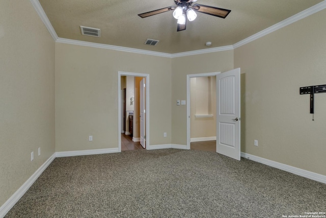 unfurnished bedroom with a textured ceiling, ceiling fan, crown molding, and light carpet