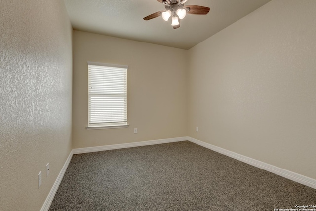 carpeted empty room with ceiling fan