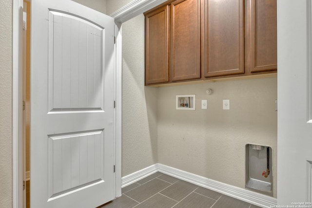 laundry area with cabinets, hookup for a washing machine, and gas dryer hookup