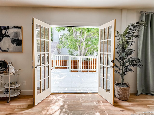 entryway featuring french doors and light hardwood / wood-style floors