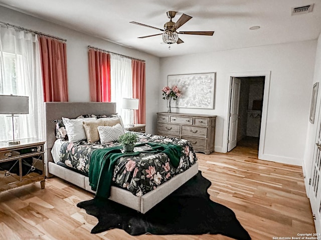 bedroom featuring light hardwood / wood-style floors and ceiling fan