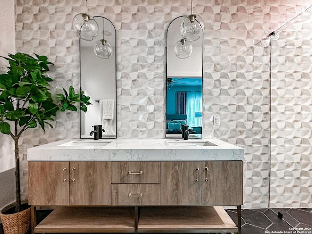 bathroom featuring tile patterned flooring, vanity, and a shower with shower door