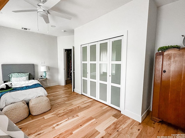 bedroom with hardwood / wood-style flooring and ceiling fan