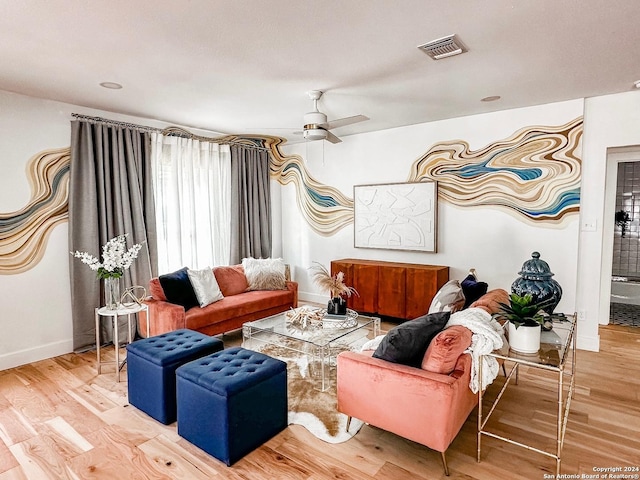 living room featuring ceiling fan and light wood-type flooring