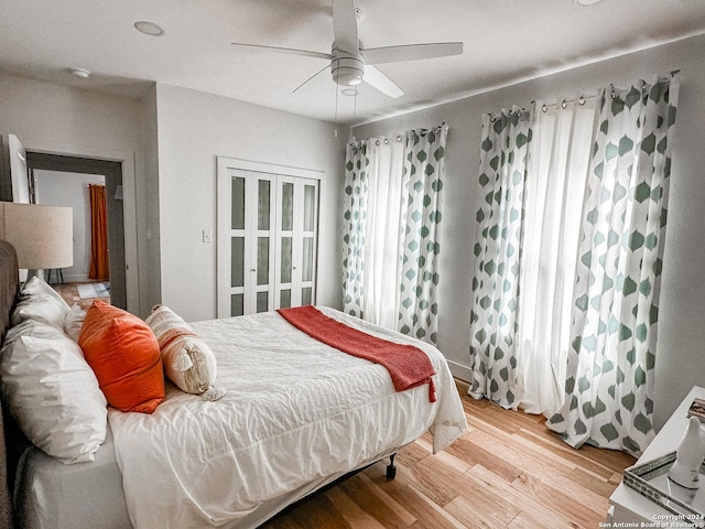 bedroom with hardwood / wood-style flooring and ceiling fan