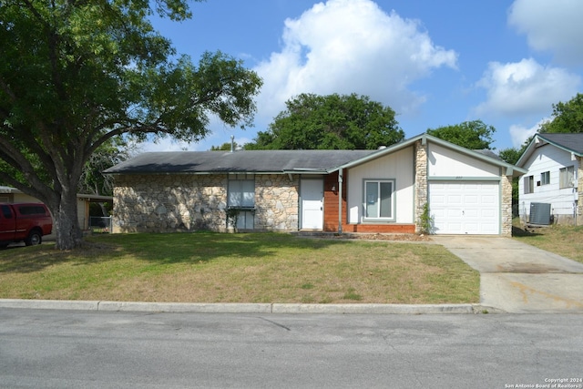 ranch-style house with central AC, a front yard, and a garage