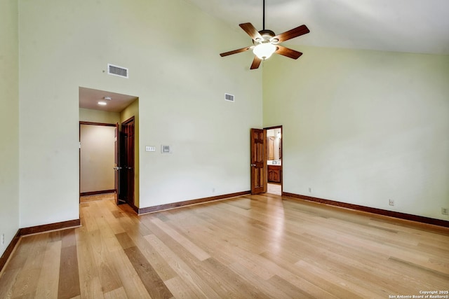 spare room featuring high vaulted ceiling, ceiling fan, and light wood-type flooring