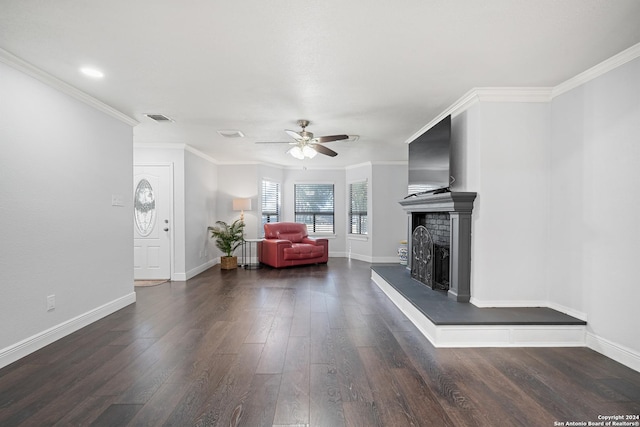 unfurnished living room with ceiling fan, dark hardwood / wood-style flooring, and ornamental molding