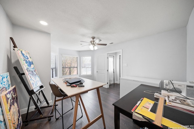 office area featuring ceiling fan, dark wood-type flooring, and a textured ceiling