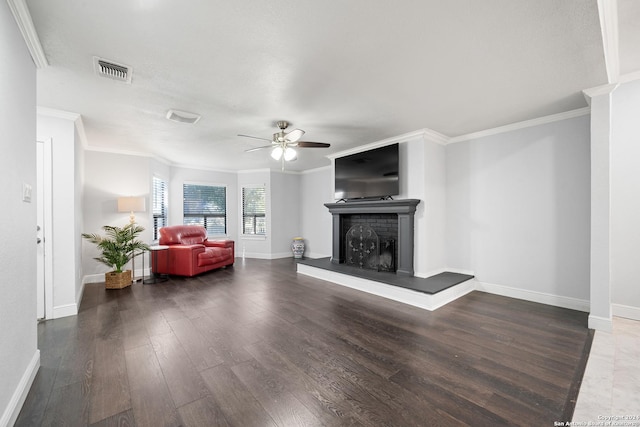 living room with ceiling fan, ornamental molding, and dark wood-type flooring