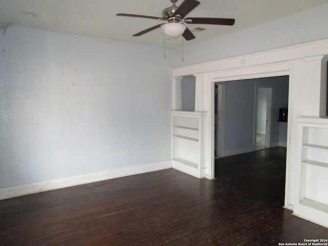 spare room with ceiling fan and dark hardwood / wood-style flooring