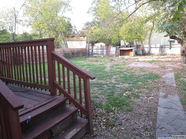 view of yard featuring a wooden deck