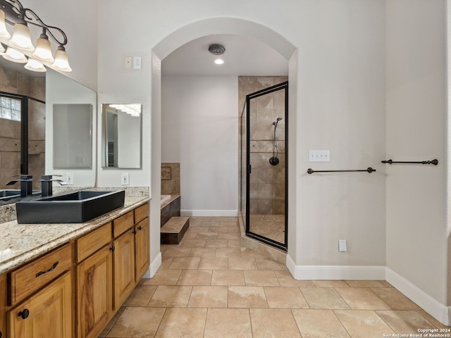 bathroom with separate shower and tub, tile patterned flooring, and vanity