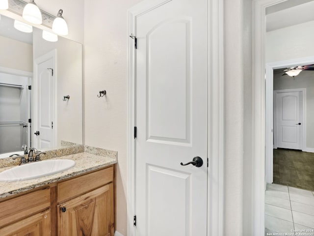 bathroom featuring tile patterned flooring and vanity