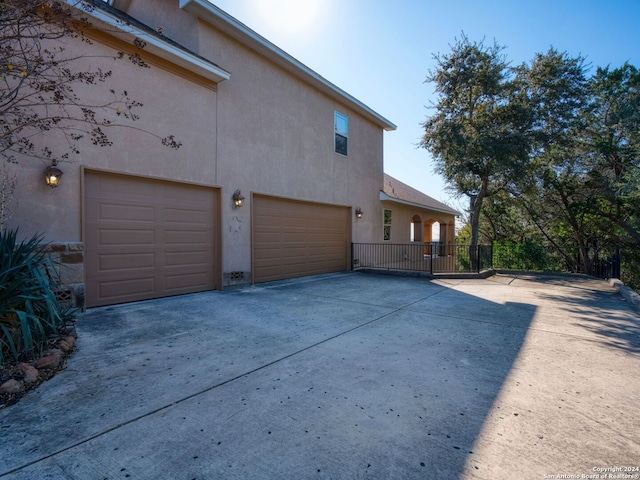 view of side of home featuring a garage