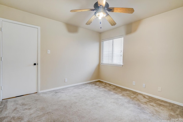 carpeted empty room with ceiling fan