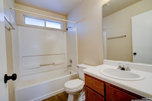 full bathroom with vanity, shower / bathtub combination, toilet, and wood-type flooring