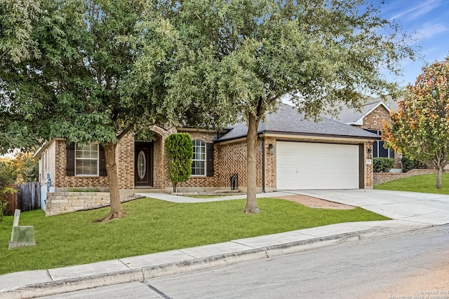 view of front of house with a front yard and a garage