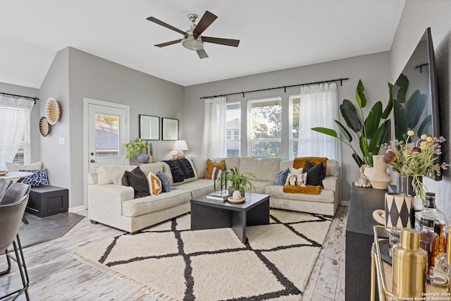 living room with ceiling fan and light hardwood / wood-style floors