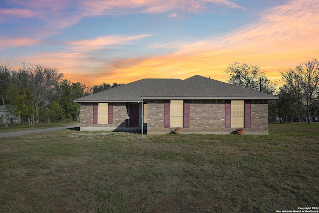 view of front of home with a lawn