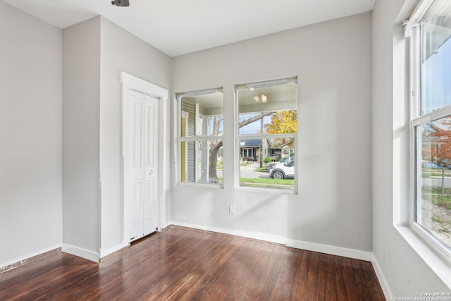 empty room featuring dark hardwood / wood-style floors