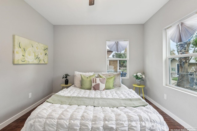 bedroom featuring ceiling fan and dark hardwood / wood-style flooring