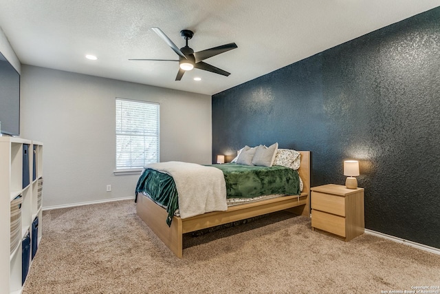 bedroom featuring ceiling fan and light carpet