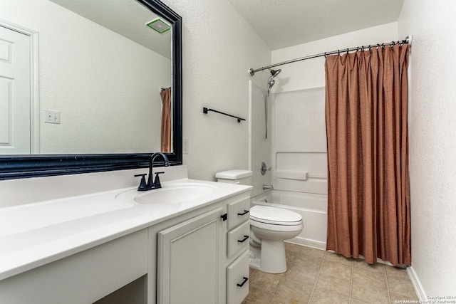 full bathroom with shower / tub combo, tile patterned floors, vanity, a textured ceiling, and toilet