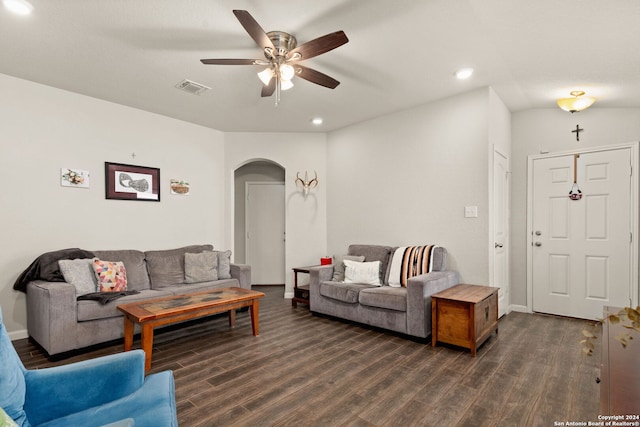 living room with ceiling fan and dark hardwood / wood-style flooring