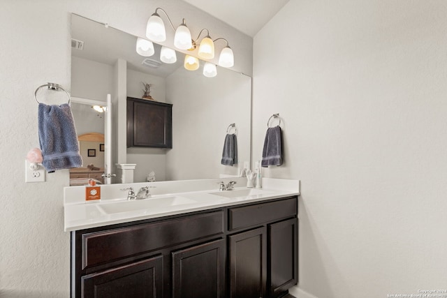 bathroom with vanity and vaulted ceiling