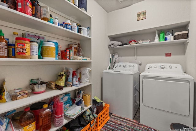 laundry room with washer and dryer